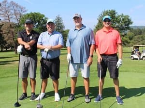 Mike Corey with golfers at the Coaches vs. Cancer 716 Golf Classic
