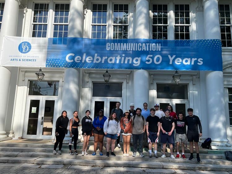 University of Delaware communication students outside Memorial Hall