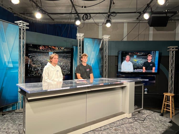 Students practicing sportscasting in the STN Studio